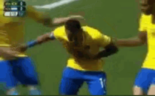 a blurry picture of soccer players in yellow and blue jerseys