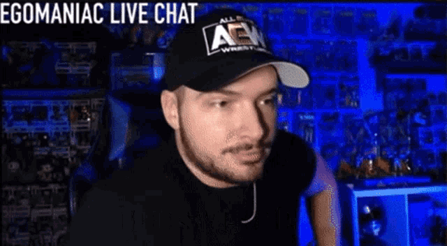 a man wearing a hat with the word aew on it is talking on a live chat .