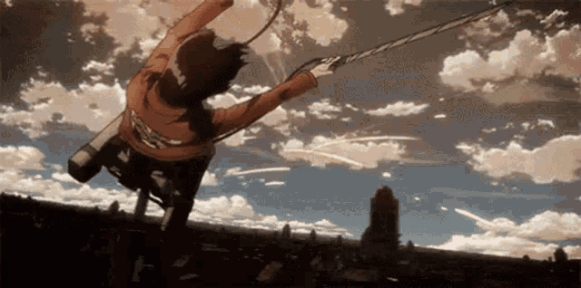 a person is flying through the air while holding a sword in their hand .