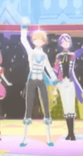 a group of anime characters are dancing on a stage in a blurry photo .