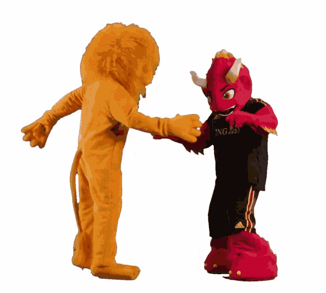 a lion mascot and a demon mascot are dancing together