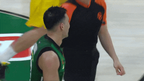 a referee with the number 10 on his shirt is talking to a player