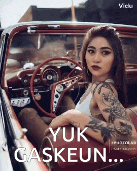 a woman with tattoos is sitting in a car with the words yuk gaskeun written on the bottom .