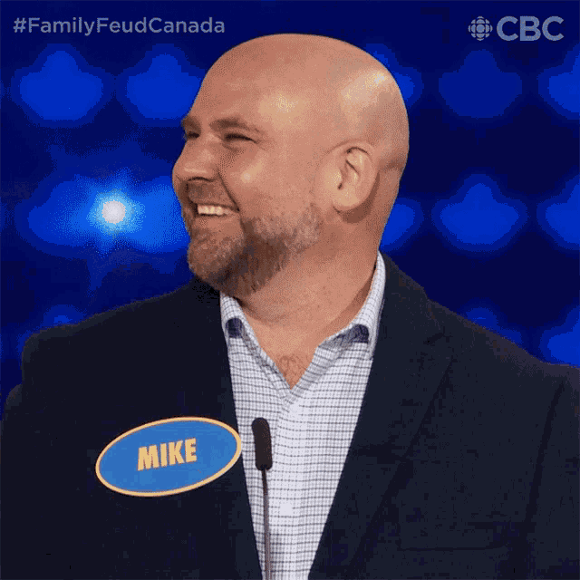 a man wearing a name tag that says mike