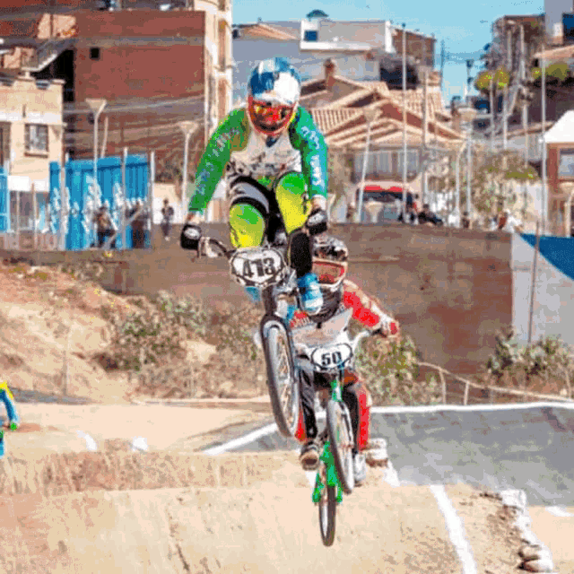 a person riding a bike with the number 12 on the front