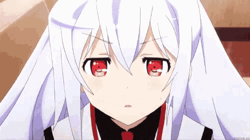 a white anime girl with red eyes is looking at the camera .