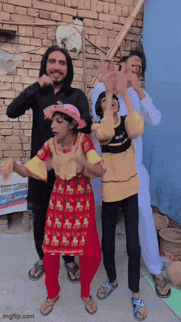 a group of people are dancing in front of a sign that says imgflip.com on it