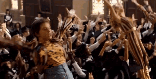 a group of people are dancing together in a room .