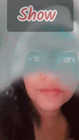 a girl with a mask on her face and the word show above her
