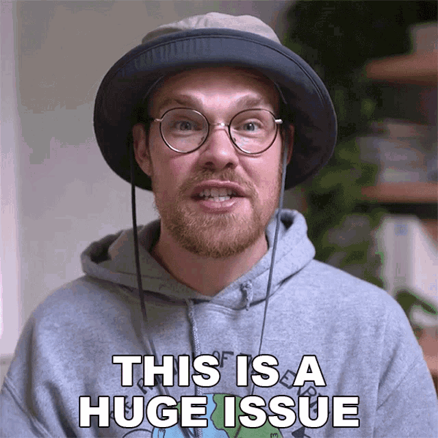 a man wearing a hat and a hoodie says this is a huge issue
