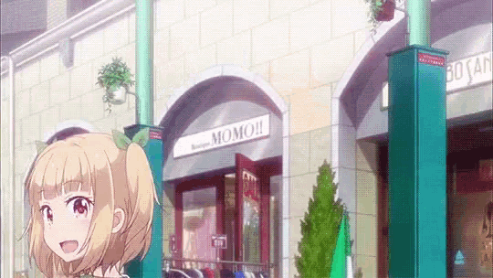 a girl in front of a momo store