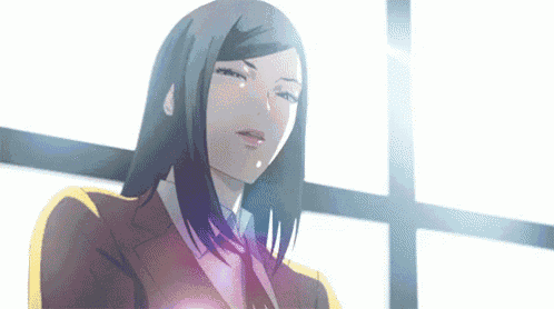 a woman with long black hair is standing in front of a window