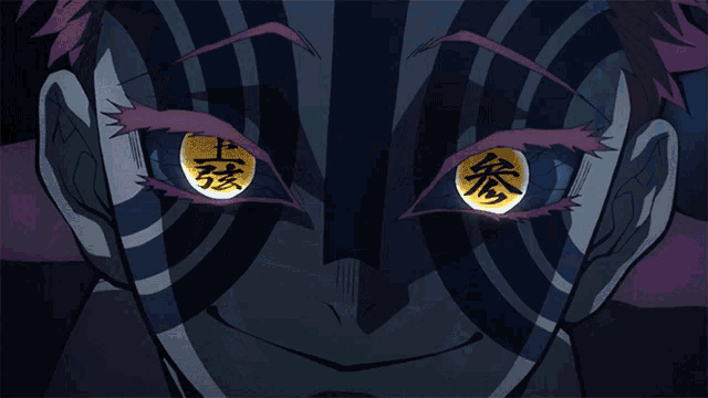 a close up of a person 's face with chinese symbols on their eyes