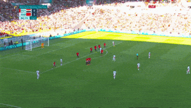 a soccer game is being played in a stadium with a scoreboard that says ecr 0 mai 5