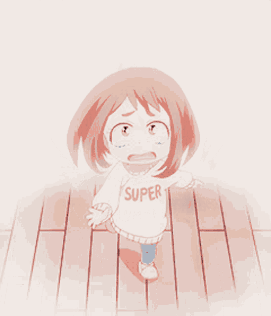 a little girl wearing a super sweater is walking on a wooden floor