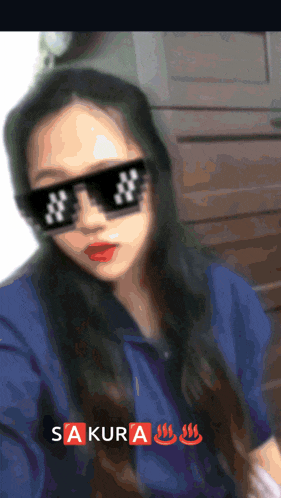 a blurred image of a woman wearing sunglasses with the word sakura on the bottom right