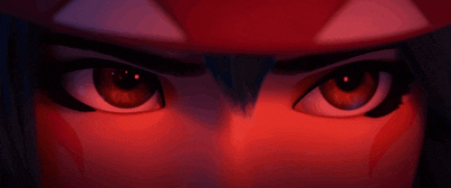 a close up of a cartoon character 's eyes with a red background .