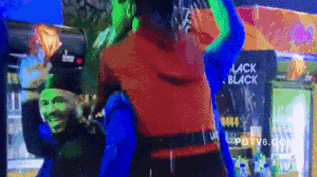 a pixelated image of people dancing in front of a sign that says black black