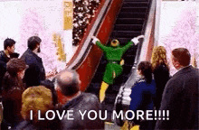 a man in a green suit is riding an escalator in front of a crowd .