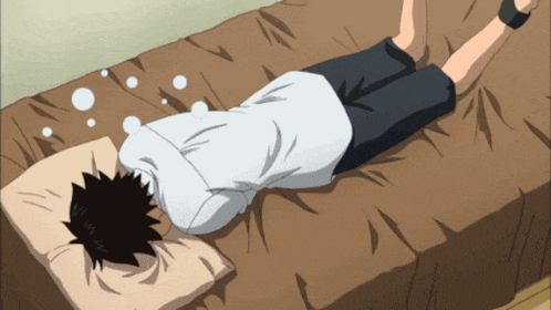 a person laying on a bed with their head on a pillow with bubbles coming out of their eyes