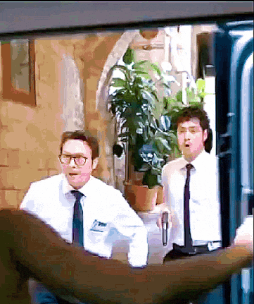 a man with glasses and a name tag that says ' smith ' on it is standing next to another man
