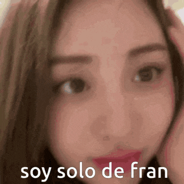 a close up of a woman 's face with the words soy solo de fran written below her