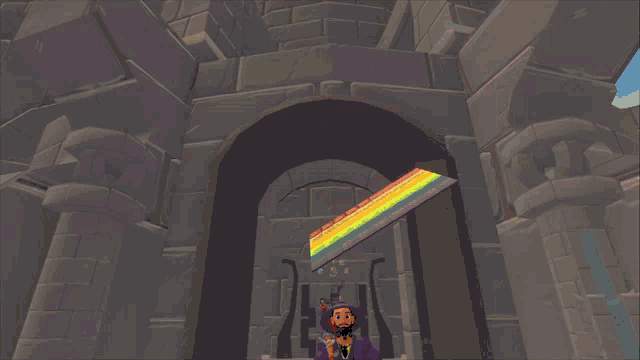 a man in a purple shirt is standing under a rainbow colored ceiling