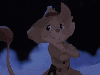 a cartoon mouse giving a thumbs up in the dark