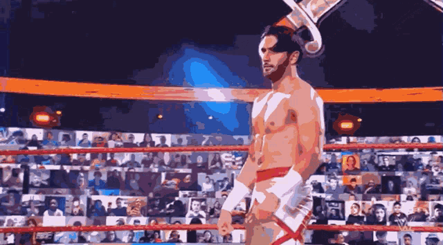 a shirtless wrestler in a ring with a crowd watching
