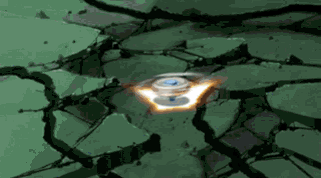 a spinning object in the middle of a cracked surface
