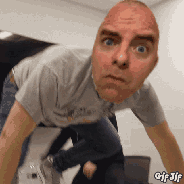 a gif of a man 's face with the words gif jif below