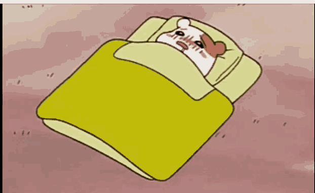 a cartoon hamster is laying in a bed with a yellow comforter
