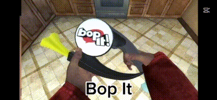 a person is holding a bop it sign in their hand