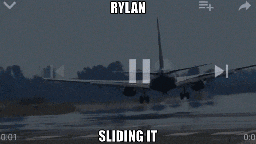 an airplane is taking off from an airport runway and the caption says rylan sliding it