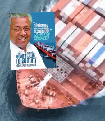 a picture of a man next to a large ship that says " comrade vijayan "