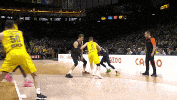 a basketball game is being played in a stadium with a sign that says zoo on it