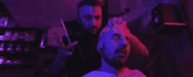 two men standing next to each other in front of a sign that says bitch bet have my c