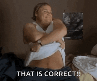 a woman is taking off her shirt and smiling with the words that is correct .