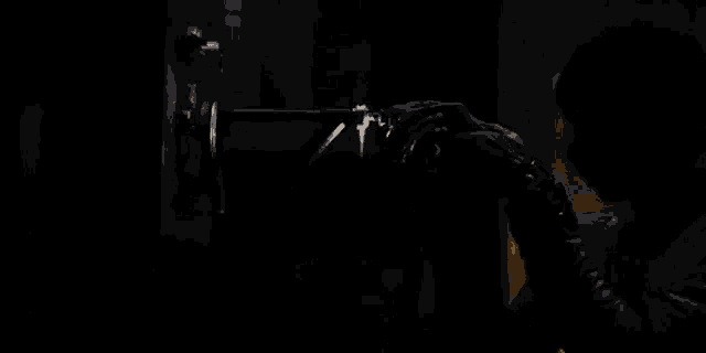 a close up of a person looking through a flashlight .