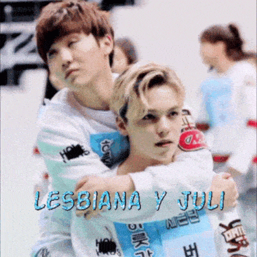 two young men hugging with the words lesbiana y juli on the bottom right