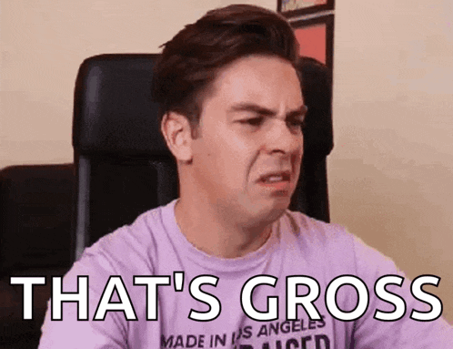 a man in a purple shirt is making a funny face and the words `` that 's gross '' are visible .