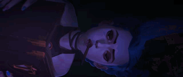 a woman is standing in a dark room surrounded by candles