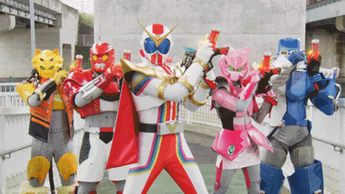 a group of power rangers standing next to each other with guns