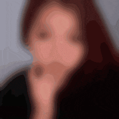 a blurry picture of a woman 's face with a black background