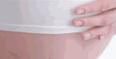 a close up of a woman 's belly with the words toel ! written above it .