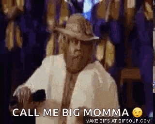 a man in a hat is holding a cell phone and saying `` call me big momma `` .