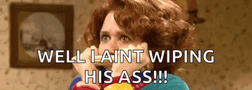 a woman is talking on a cell phone and saying `` well i ain 't wiping his ass ! ''