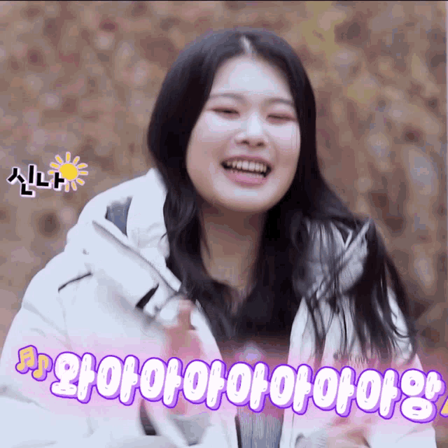 a woman in a white jacket is smiling with purple letters that say ' o ' on it