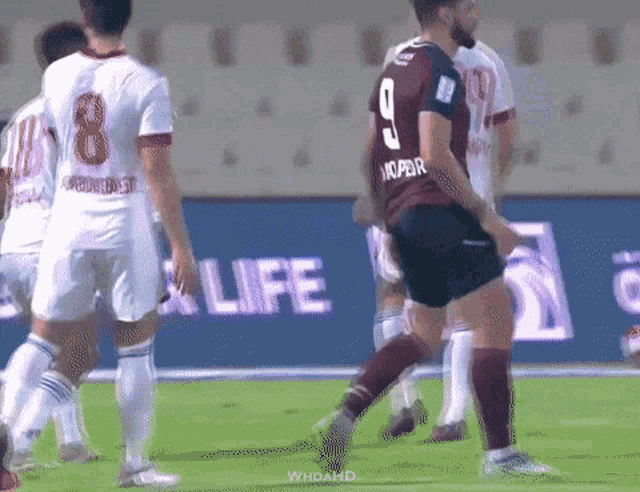 a soccer player with the number 9 on the back of his shirt