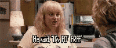 a woman is sitting at a table talking to a man and says `` he said it 's go free '' .